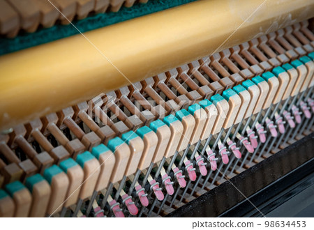 Details of piano mechanism gavel - string, pins and hammers Details of piano mechanism gavel - string, pins and hammers 98634453