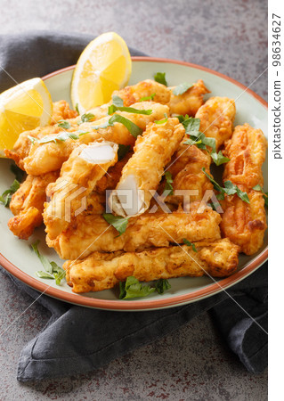 Fried Spanish Squid Rabas Fritas closeup on the plate. Vertical 98634627