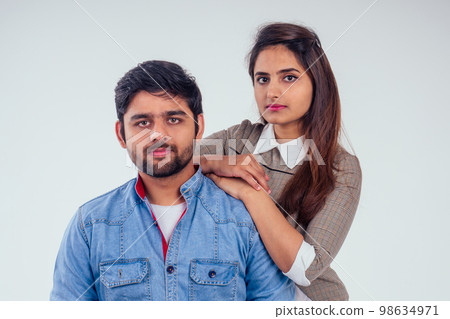 indian couple in love posing at studio white background 98634971