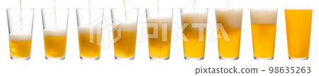 Pouring beer in shaker pint glass isolated 98635263