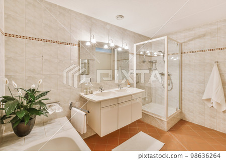 a bathroom with a sink, toilet, and bathtub in the same color as it appears on the wall 98636264