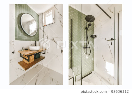 a bathroom with green tiled walls and white flooring, the shower is surrounded by a round mirror on the wall a bathroom with green tiled walls and white flooring, the shower is surrounded by a round mirror on the wall 98636312