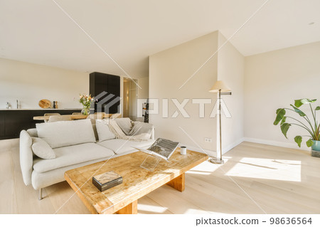 a living room with wood flooring and white couches in the room is very large, open space that can be used for 98636564