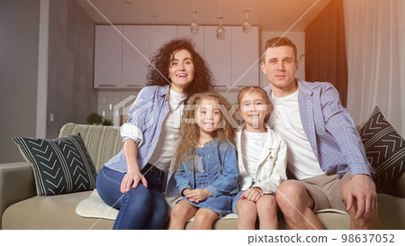 Girls siblings fall on cosy sofa and enjoy playing together Girls siblings fall on cosy sofa and enjoy playing together 98637052