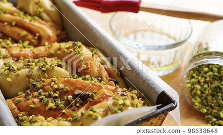 Caramel Sauce and Pistachio Twisted Bread Babka Made with Brioche Dough Caramel Sauce and Pistachio Twisted Bread Babka Made with Brioche Dough 98638648