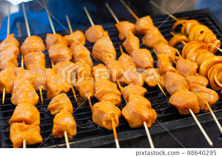 chicken wings are fried on the grill. Spring picnic chicken wings are fried on the grill. Spring picnic 98640295