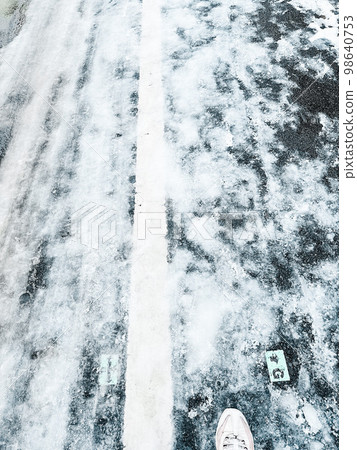 Frozen snow road the day after it snowed Frozen snow road the day after it snowed 98640753