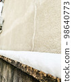 soft snow on the fence 98640773