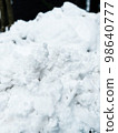 Clumps of snow after shoveling 98640777