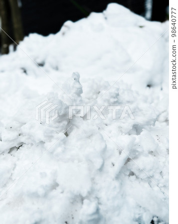 Clumps of snow after shoveling Clumps of snow after shoveling 98640777