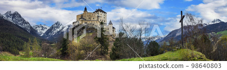 Switzerland travel and landmraks. Impressive mountain scenery with amazing medieval castle Tarasp surrounded by Swiss Alps, Canton Grisons or Graubuendon Switzerland travel and landmraks. Impressive mountain scenery with amazing medieval castle Tarasp surrounded by Swiss Alps, Canton Grisons or Graubuendon 98640803