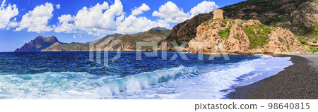Corsica island beaches and nature scenery. Tower of Portu - historic Genoese tower and beach in village Ota in west of the island. France 98640815
