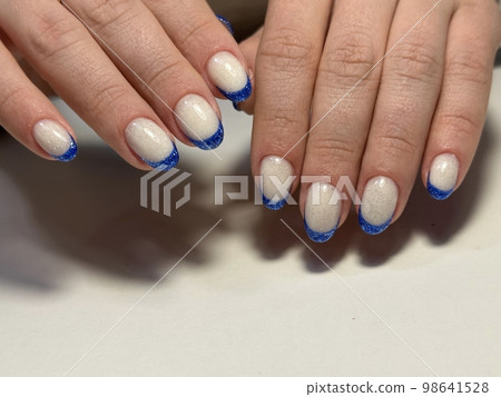 Trendy manicure design on a beautiful background. Trendy manicure design on a beautiful background. 98641528