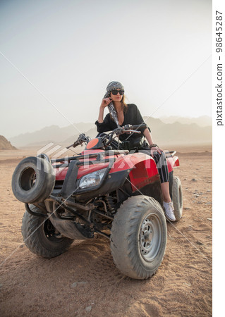 Pretty young woman dressing in casual clothes Pretty young woman dressing in casual clothes 98645287