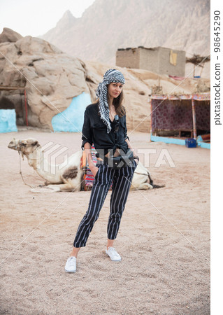 Beautiful young woman in keffiyeh Beautiful young woman in keffiyeh 98645290
