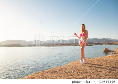 Sexy young woman wearing a swimsuit 98645356