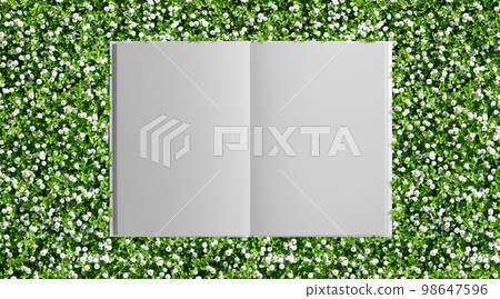 A green garden with beautiful small flowers and a background of a white book 98647596