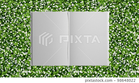 Background of a green garden with beautiful small flowers and a white book with a bookmark Background of a green garden with beautiful small flowers and a white book with a bookmark 98648022
