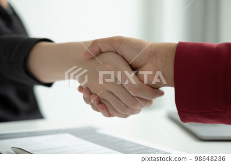 Employer shake hand with job applicants congratulates and welcomes new hires after successful negotiations for a job interview. Recruitment concepts Employer shake hand with job applicants congratulates and welcomes new hires after successful negotiations for a job interview. Recruitment concepts 98648286