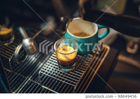 Wonderful espresso shot pouring out 98649456