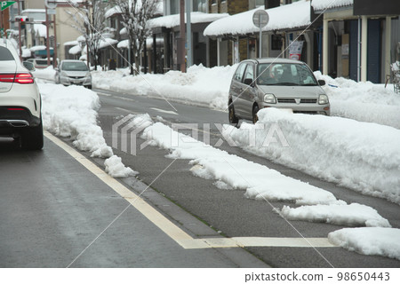 Snow-covered road Snow-covered road 98650443