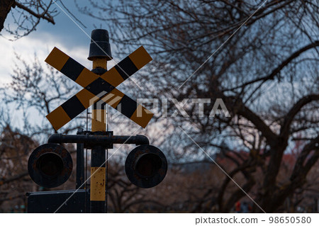 A creepy railroad crossing warning sign A creepy railroad crossing warning sign 98650580