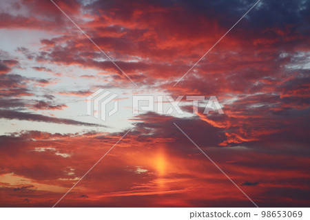 orange sunset clouds and light 98653069
