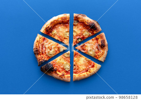 Homemade vegetarian pizza above view on a blue background Homemade vegetarian pizza above view on a blue background 98658128