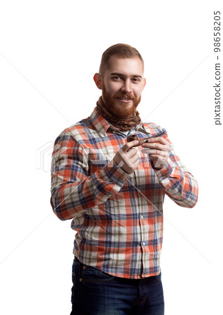 Portrait of handsome bearded redhead man in checked shirt who smoking pipe on white background  98658205