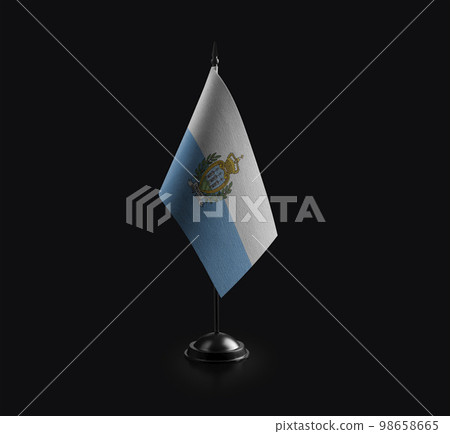Small national flag of the San Marino on a black background 98658665