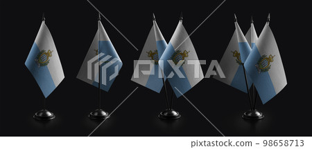 Small national flags of the San Marino on a black background Small national flags of the San Marino on a black background 98658713