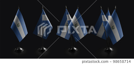 Small national flags of the Salvador on a black background 98658714