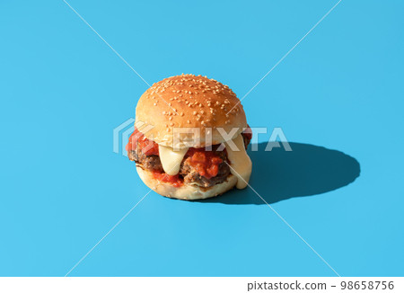 Burger with meatballs isolated on a blue background 98658756
