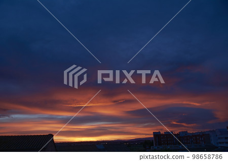 Clouds of different colors in a sunset Clouds of different colors in a sunset 98658786