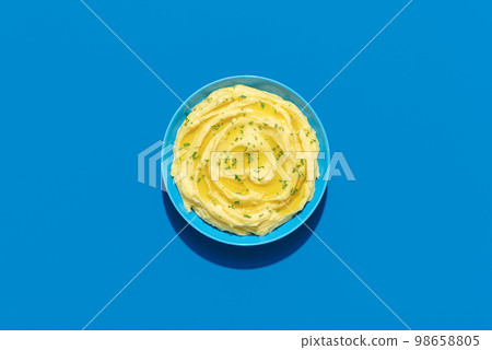 Mashed potatoes above view on a blue background 98658805