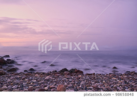 Rocky beach at sunrise, colors Rocky beach at sunrise, colors 98658848