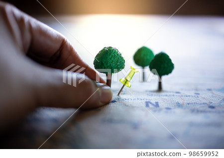 Plant a Tree Concept. Close-up of Businessman Planning to Plant more Tree for ESG Project. Responsible and Sustainable Business. World Earth Day, Environmental Care. Plant a Tree Concept. Close-up of Businessman Planning to Plant more Tree for ESG Project. Responsible and Sustainable Business. World Earth Day, Environmental Care. 98659952