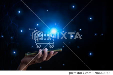 Phone and basket hologram.E-commerce add to cart online shopping business technology internet concept. Online shopping, online store application in a smartphone. Digital Marketing Online Phone and basket hologram.E-commerce add to cart online shopping business technology internet concept. Online shopping, online store application in a smartphone. Digital Marketing Online 98660948
