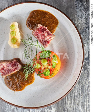 Beautiful and tasty food on a plate Beautiful and tasty food on a plate 98661654