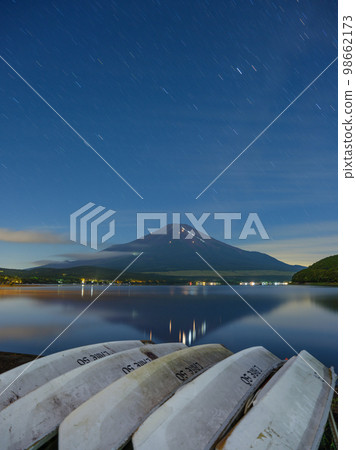 Mt. Fuji _ Scenery of the lights of climbers seen from Lake Yamanaka Mt. Fuji _ Scenery of the lights of climbers seen from Lake Yamanaka 98662173