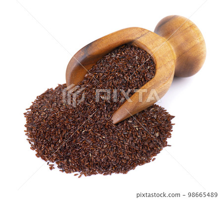 Psyllium seeds in wooden scoop, isolated on white background. Plantain. Plantago psyllium. 98665489
