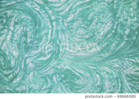 liquid turquoise epoxy resin top view. Background liquid turquoise epoxy resin top view. Background 98666980