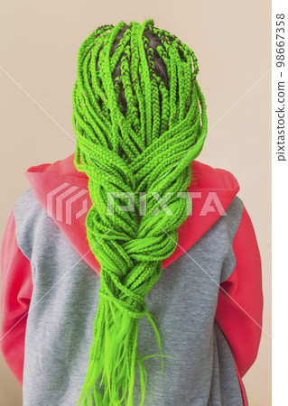 Teenage girl with green pigtails girl turned her back 98667358