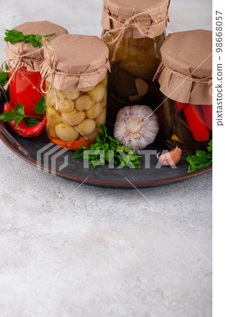Pickled vegetables in glass jars. Pickled vegetables in glass jars. 98668057