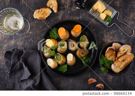Baked snails Escargot with bread 98668134