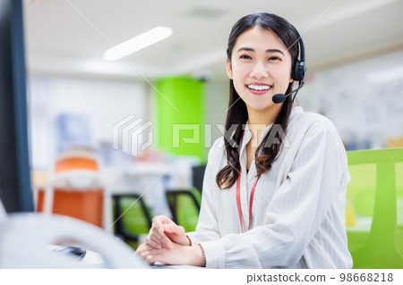 Young woman working in a call center 98668218
