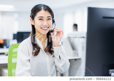Young woman working in a call center Young woman working in a call center 98668222