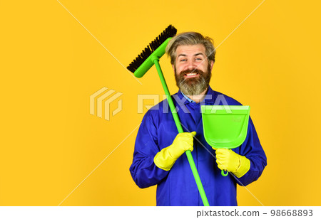 spring cleaning. clean service people. mature male worker with broom cleaning. Male Janitor Cleaning With Broom. Man cleaning home with broom. Janitor man sweeping. copy space 98668893
