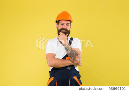 positive plumber. brutal male worker with beard. he is just artisan. choose your occupation. construction engineer in work uniform. man builder in hard hat. wear helmet for safety. expert in building positive plumber. brutal male worker with beard. he is just artisan. choose your occupation. construction engineer in work uniform. man builder in hard hat. wear helmet for safety. expert in building 98669101