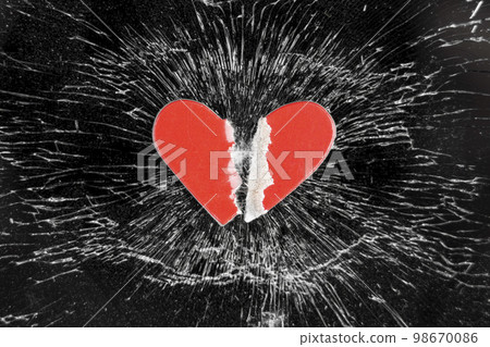 Broken love concept with torn paper heart on crashed glass smartphone touchscreen 98670086